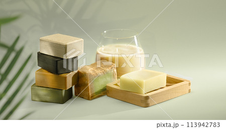 Handmade Soaps on green background. 113942783