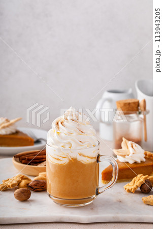 Pumpkin pie latte with whipped cream and cinnamon 113943205