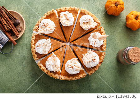 Traditional pumpkin pie for Thanksgiving with whipped cream 113943336
