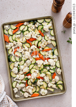 Various vegetables ready to be roasted, sheet pan side dish recipe 113943413