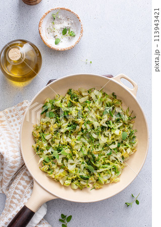 Sauteed cabbage in a cast iron pan, side dish idea Sauteed cabbage in a cast iron pan, side dish idea 113943421