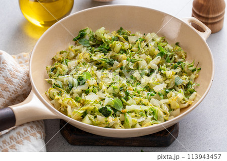 Sauteed cabbage in a cast iron pan, side dish idea 113943457