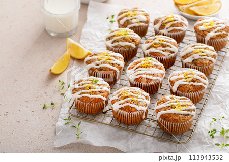 Lemon zucchini muffins with thyme and cream cheese glaze 113943532