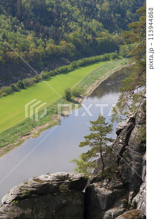 Beautiful summer view of Elbe river from Bastei view pont. Colorful morning scene of Saxon Switzerland national park, Germany, Europe. Splendid landscape of Sandstone Mountains, Saxony. 113944868
