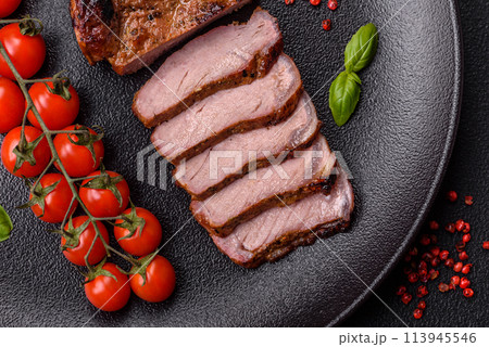 Delicious juicy beef steak on the bone, tomahawk with salt, spices and herbs 113945546