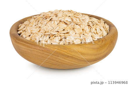 Oat flakes in wooden bowl isolated on white background with full depth of field Oat flakes in wooden bowl isolated on white background with full depth of field 113946968