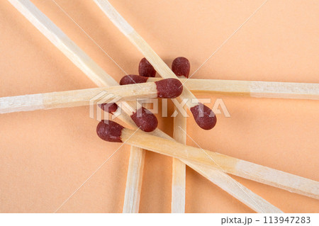 Pile of matches on a light background. Fire safety 113947283
