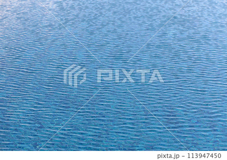 Blue water. Background. Rest in the pool. Pure water. Waves. Blue background.1 Blue water. Background. Rest in the pool. Pure water. Waves. Blue background.1 113947450