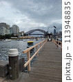 Sydney's harbour foreshore set against the famous Sydney Harbour bridge on a cloudy overcast day 113948835