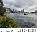 Sydney's harbour foreshore set against the famous Sydney Harbour bridge on a cloudy overcast day 113948839