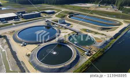 A view of a water treatment plant with three large tanks A view of a water treatment plant with three large tanks 113948895