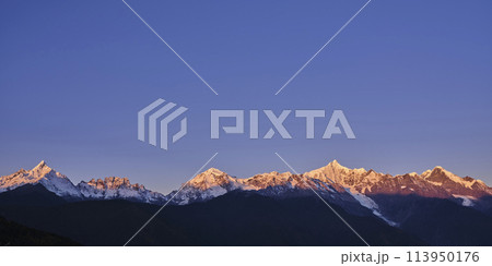 snow capped meili mountain range at sunrise, yunnan, china snow capped meili mountain range at sunrise, yunnan, china 113950176