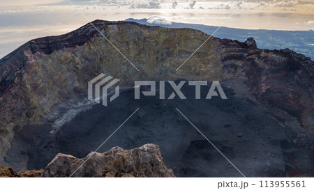 Sunrise at the top of the Ijen volcano. Panoramic view of East Java, Indonesia. The background of the natural landscape. 113955561