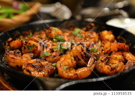 Spicy roasted shrimps in cast iron pan. 113958535