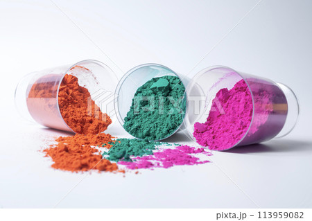 Colorful holi powder in a glass container isolated on white background. Colorful holi powder in a glass container isolated on white background. 113959082