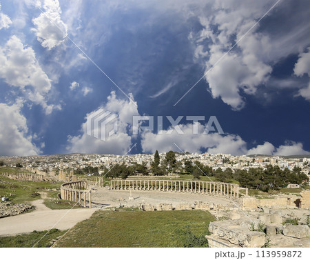 Forum (Oval Plaza) in Gerasa (Jerash), Jordan. Was built in the first century AD. Against the background of a beautiful sky with clouds. Forum (Oval Plaza) in Gerasa (Jerash), Jordan. Was built in the first century AD. Against the background of a beautiful sky with clouds. 113959872