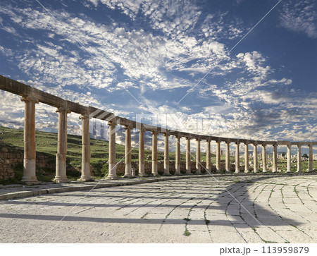 Forum (Oval Plaza) in Gerasa (Jerash), Jordan. Was built in the first century AD. Against the background of a beautiful sky with clouds. Forum (Oval Plaza) in Gerasa (Jerash), Jordan. Was built in the first century AD. Against the background of a beautiful sky with clouds. 113959879