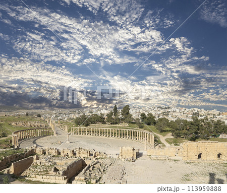 Forum (Oval Plaza) in Gerasa (Jerash), Jordan. Was built in the first century AD. Against the background of a beautiful sky with clouds. Forum (Oval Plaza) in Gerasa (Jerash), Jordan. Was built in the first century AD. Against the background of a beautiful sky with clouds. 113959888