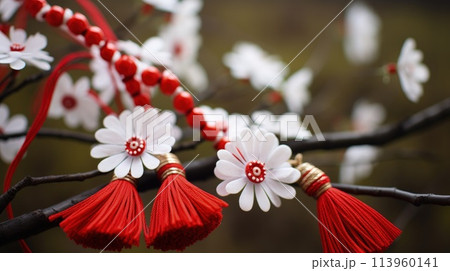 Celebrating spring's cheer: the joyous tradition of happy martisor, a Romanian cultural festivity marked by red and white talismans, symbolizing luck, optimism, and festive merriment on March 1st 113960141