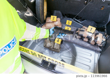 Drug smuggling in the trunk of a car 113961966