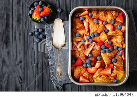 berry croissant casserole in baking dish, top view berry croissant casserole in baking dish, top view 113964047