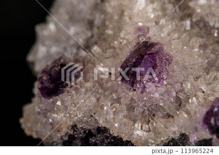 macro mineral fluorite stone on black background macro mineral fluorite stone on black background 113965224