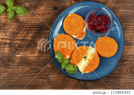 Delicious fried camembert cheese with sauce Delicious fried camembert cheese with sauce 113965935