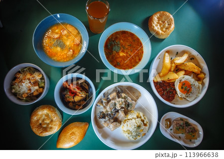 Top view of delicious and healthy food on the green table. 113966638