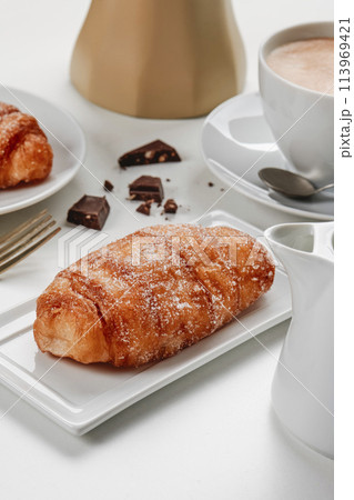 xuixo typical of spain, and cup of coffee 113969421