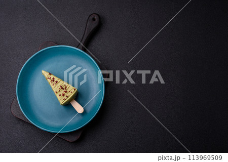 Delicious sweet cheesecake with fruits covered with icing 113969509