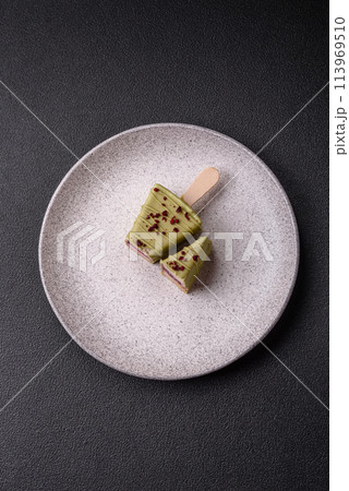 Delicious sweet cheesecake with fruits covered with icing 113969510