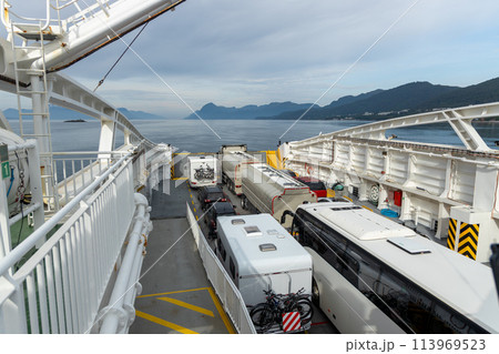 Car ferry crossing Fjord in Norway. Car ferry crossing Fjord in Norway. 113969523