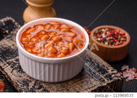 Delicious nutritious canned beans in tomato, with salt and spices Delicious nutritious canned beans in tomato, with salt and spices 113969535