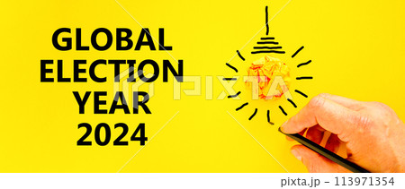 Global election year 2024 symbol. Concept words Global election year 2024 on beautiful yellow paper. Beautiful yellow background. Voter hand. Business Global election year 2024 concept. Copy space Global election year 2024 symbol. Concept words Global election year 2024 on beautiful yellow paper. Beautiful yellow background. Voter hand. Business Global election year 2024 concept. Copy space 113971354