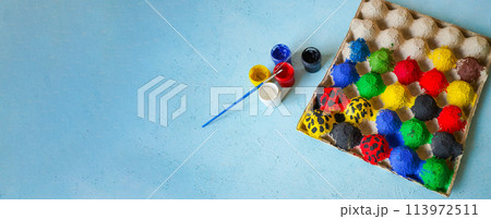 Gouache color painting on eggs box for kids to play 113972511