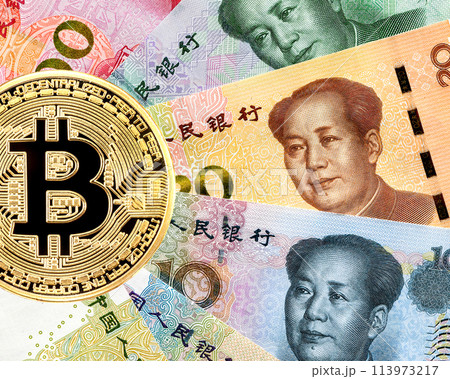 Bitcoin cryptocurrency and banknotes of Chinese money with portrait of Mao Zedong 113973217