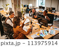 Business people in office work together during a meeting 113975914