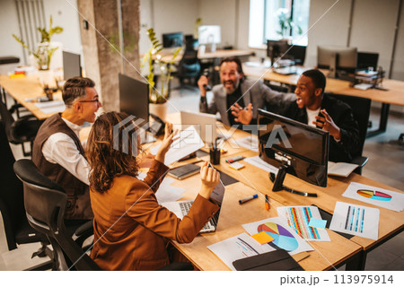 Business people in office work together during a meeting 113975914