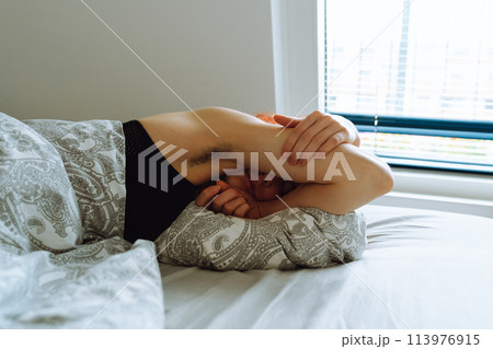 morning, young woman waking up in bed with natural hair under arms morning, young woman waking up in bed with natural hair under arms 113976915