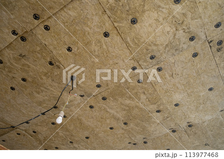 Insulation panels made of mineral wool, which were glued to the ceiling. Insulation panels made of mineral wool, which were glued to the ceiling. 113977468