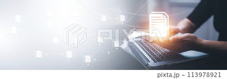 Businesswoman working on laptop with virtual screen. Online documentation database, IT consultant being set up Virtual Document Management System with a laptop, Software for archiving corporate files. 113978921