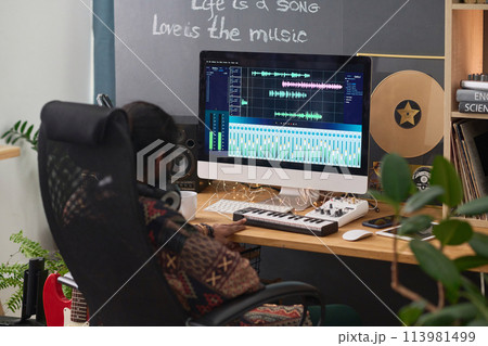 Creating new music in front of computer Creating new music in front of computer 113981499
