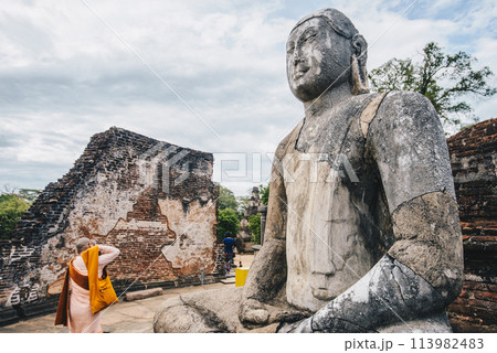 The ancient stone Buddha on the upper platform in the Vatadage, ancient city of Polonnaruwa. Polonnaruwa Vatadage is a circular relic house unique to the architecture of ancient Sri Lanka. 113982483