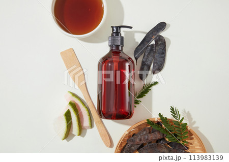 The concept of gleditsia australis fruit photography with view from above with blank space for design. Photo for cosmetic advertising The concept of gleditsia australis fruit photography with view from above with blank space for design. Photo for cosmetic advertising 113983139