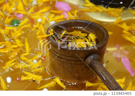 bamboo ladles and flower petals with water bamboo ladles and flower petals with water 113985405