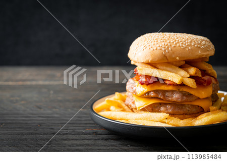 pork burger with cheese, bacon and french fries pork burger with cheese, bacon and french fries 113985484