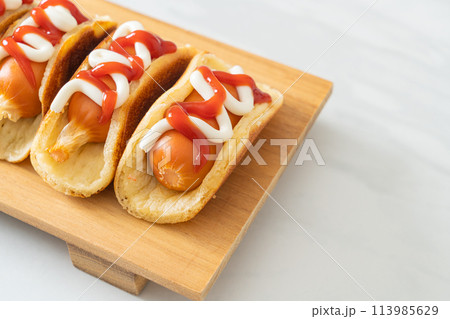 flat pancake roll with sausage 113985629