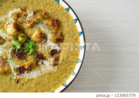 Afghani chicken in green masala curry or Hariyali tikka chicken hara masala 113985779