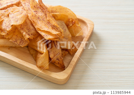 Taro Chips - fried or baked sliced taro 113985944