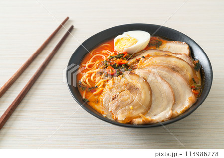 Ramen Noodles Spicy Tomyum Soup with Roast Pork Ramen Noodles Spicy Tomyum Soup with Roast Pork 113986278